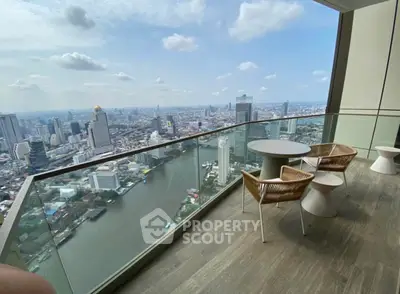 Stunning high-rise balcony with breathtaking city and river views, perfect for urban living.