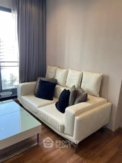 Modern living room with stylish white sofa and elegant decor