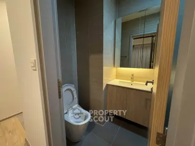 Modern bathroom with sleek design and elegant fixtures in a contemporary home.