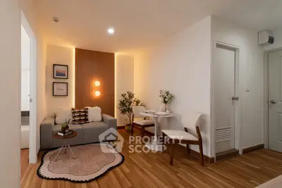 Modern living room with cozy seating and elegant decor in a stylish apartment.