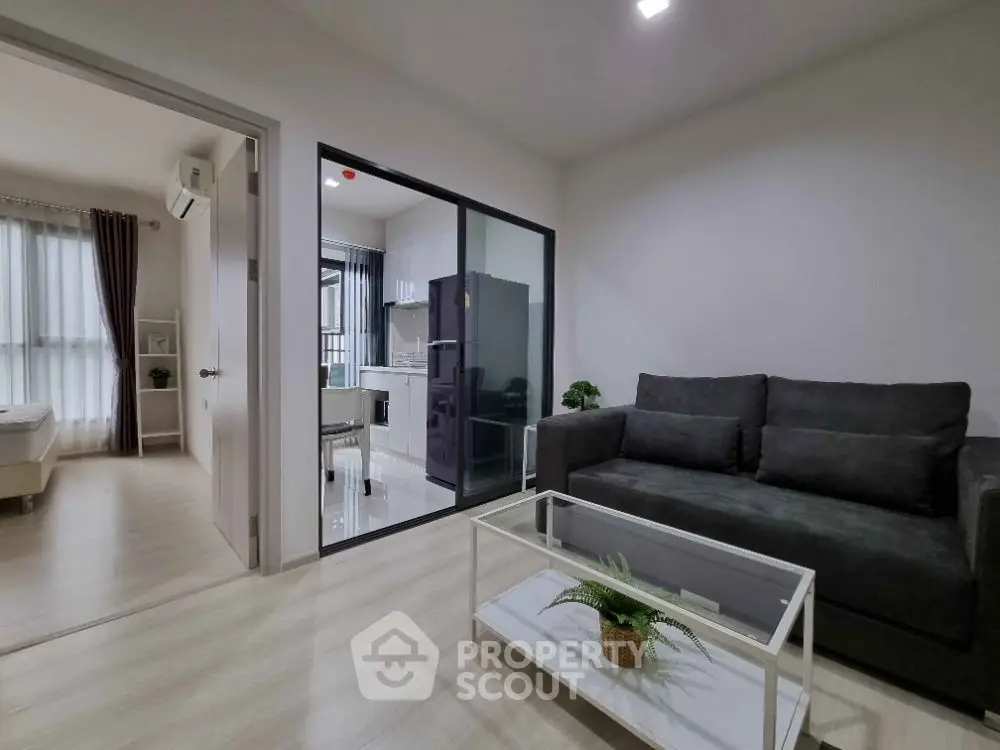 Modern living room with glass partition and cozy sofa in a stylish apartment