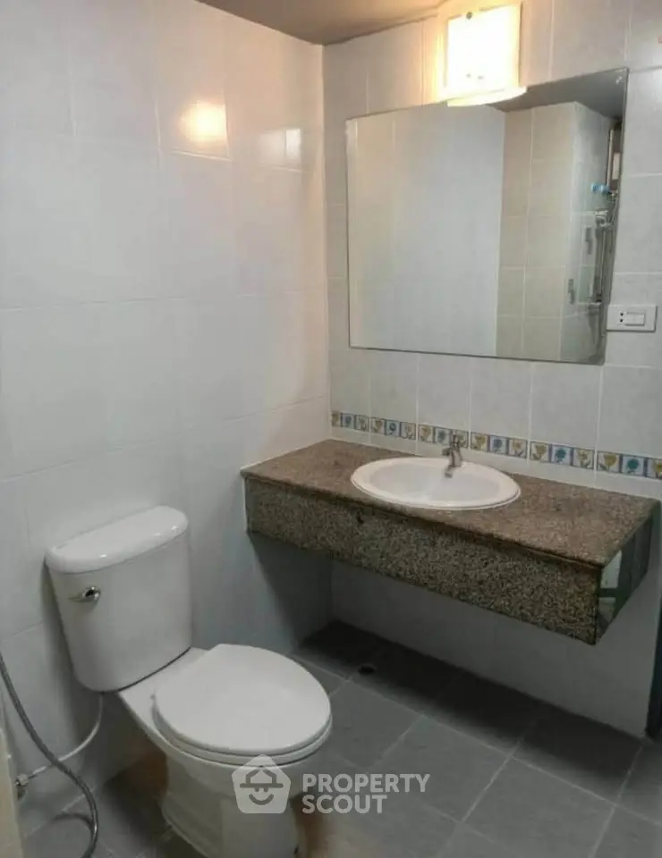 Modern bathroom with sleek fixtures and elegant tile design, perfect for a contemporary home.