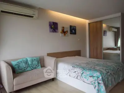 Cozy bedroom with modern decor and mirrored wardrobe