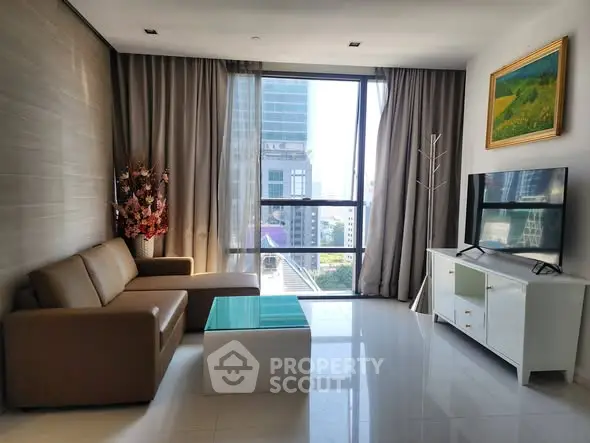 Modern living room with city view, sleek furniture, and natural light.