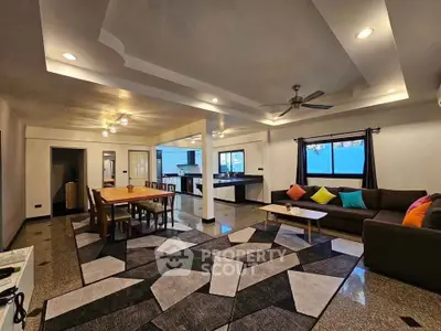 Spacious modern living room with stylish decor and open layout, perfect for entertaining.