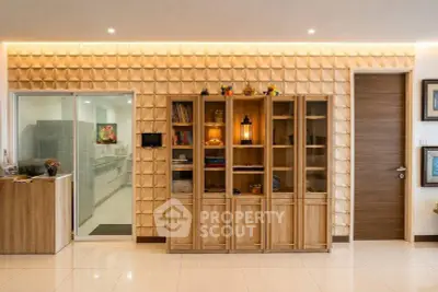 Elegant living room with modern wooden shelving and stylish wall design