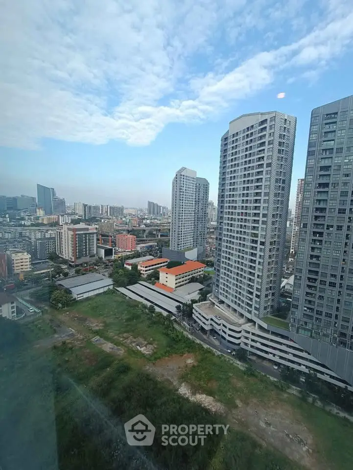 Stunning cityscape view from high-rise building showcasing modern urban living.