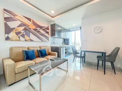 Modern living room with stylish decor and open kitchen layout