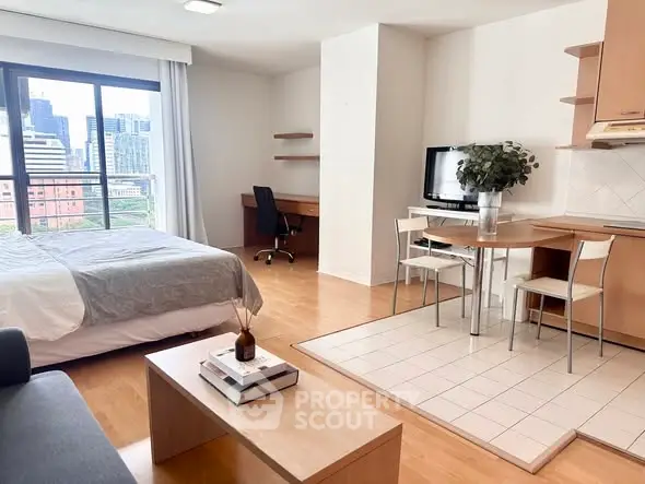Modern studio apartment with city view, featuring cozy living area, workspace, and dining space.
