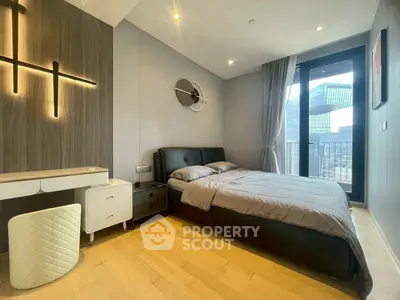 Modern bedroom with sleek design and city view from large window