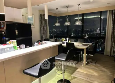 Luxurious modern kitchen with stunning city view, featuring sleek design and elegant lighting.
