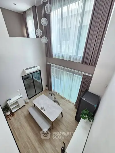 Stunning modern living room with high ceilings and elegant decor