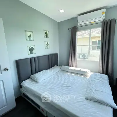 Cozy bedroom with modern decor and natural light