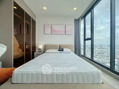 Luxurious bedroom with panoramic city view and modern decor