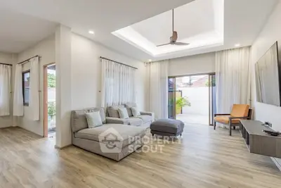 Spacious modern living room with natural light and stylish decor