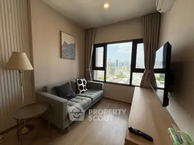 Modern living room with city view, featuring a cozy sofa and wall-mounted TV, perfect for urban living.