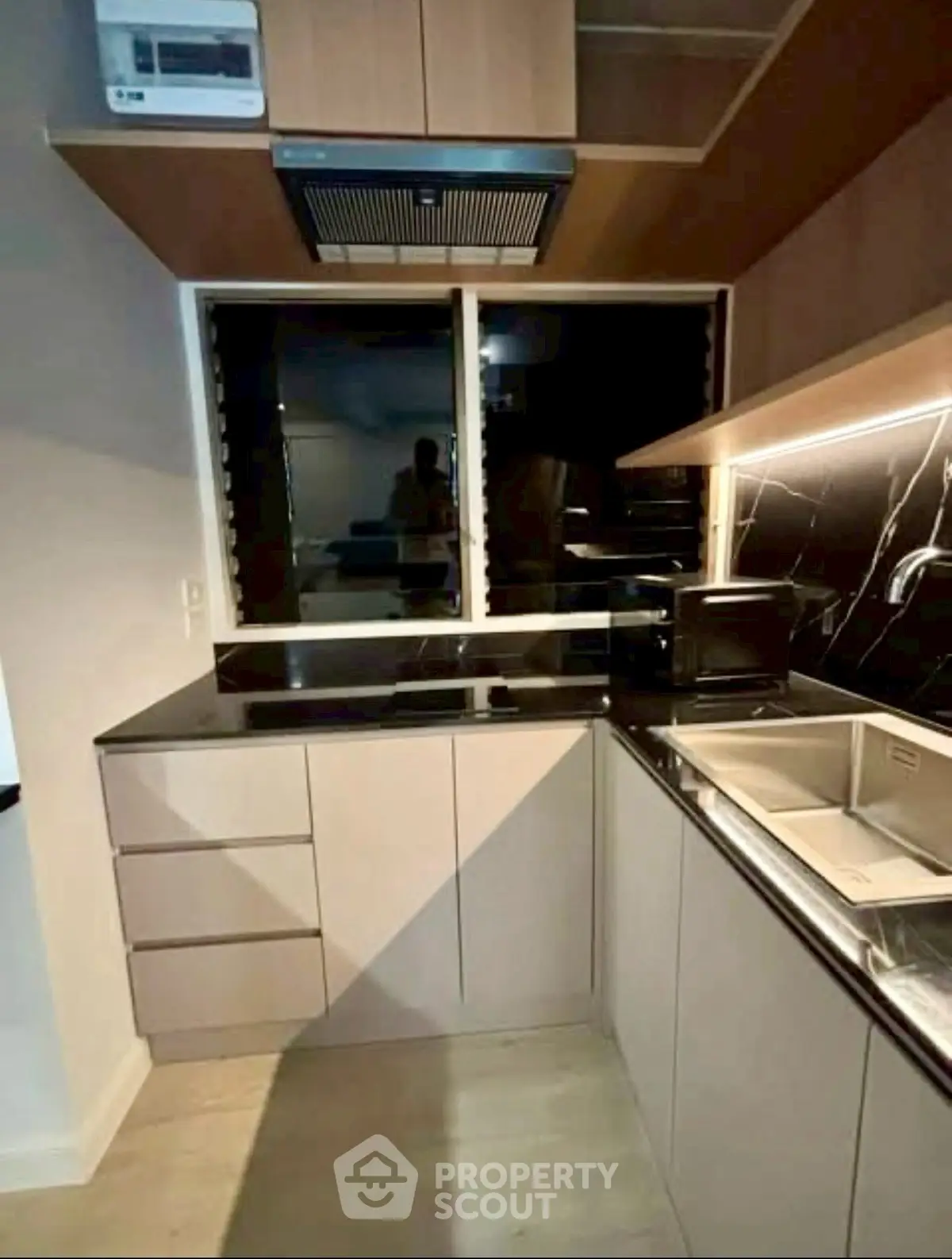 Modern kitchen with sleek cabinetry and under-cabinet lighting