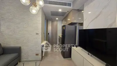 Modern living room with sleek kitchen and stylish decor