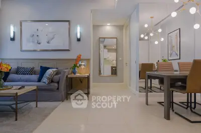 Modern living room with stylish decor and dining area, featuring elegant lighting and contemporary furniture.