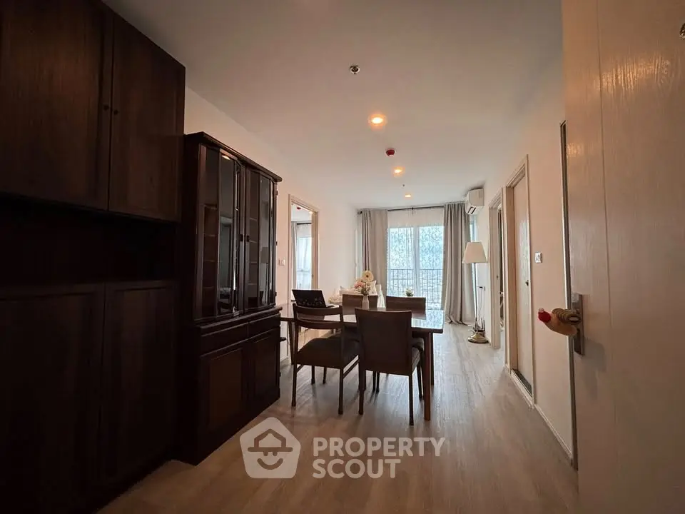 Spacious dining area with elegant wooden furniture and natural light