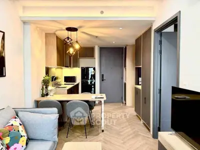 Modern open-plan living room and kitchen with stylish decor and lighting