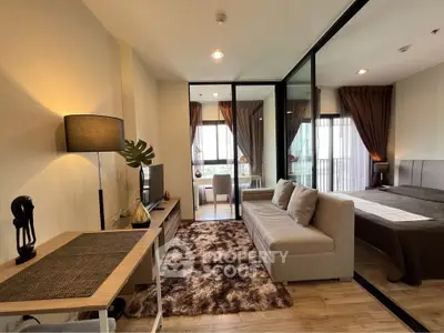 Modern living room with cozy sofa and stylish decor in open-plan apartment