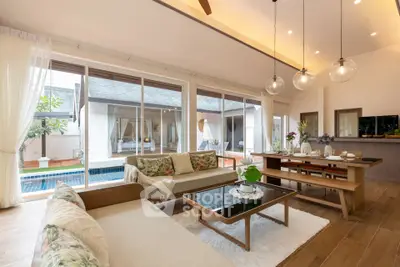 Spacious living room with pool view and elegant decor