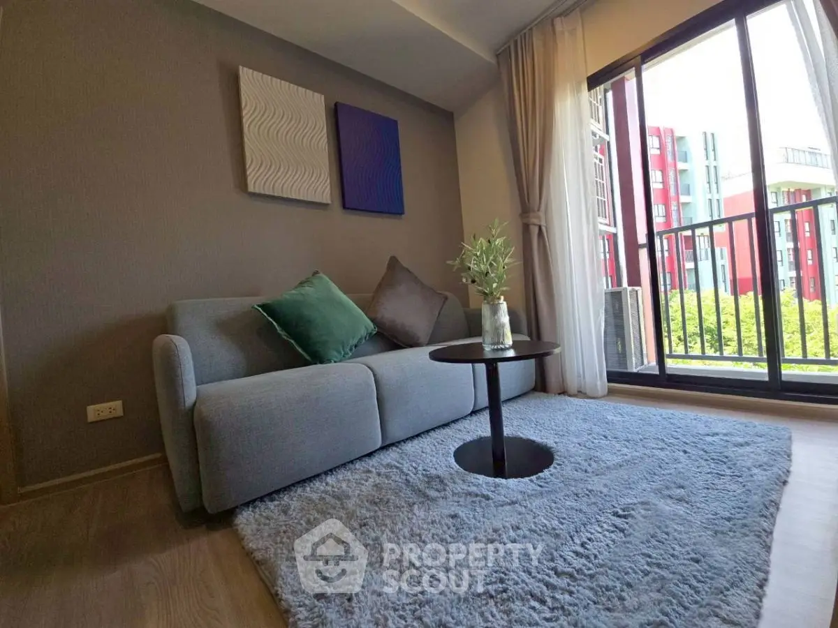 Cozy living room with modern decor and balcony view