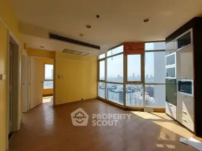 Spacious corner unit with panoramic city views and abundant natural light.