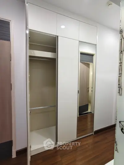 Modern wardrobe with sliding doors in a sleek interior design