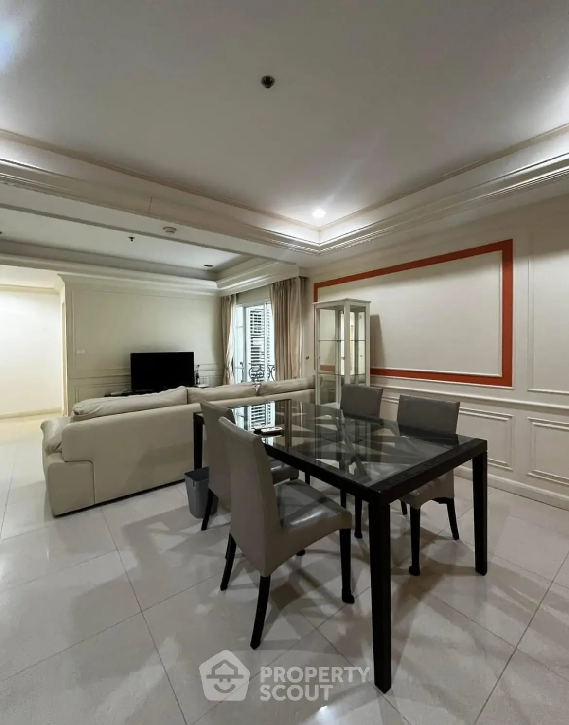 Spacious living room with elegant dining area and modern decor