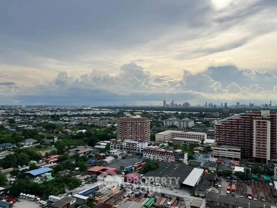 Stunning cityscape view from high-rise building with expansive skyline and lush greenery.