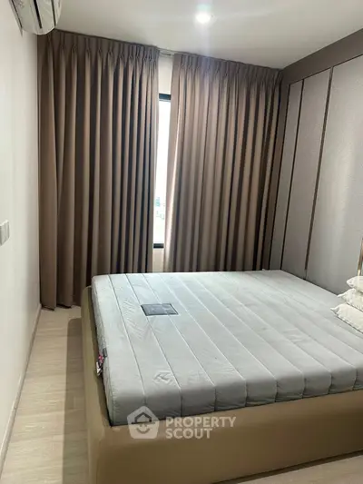 Cozy bedroom with modern design and ample natural light