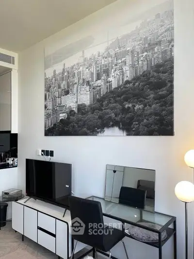 Modern living room with stylish decor, featuring a large cityscape artwork and sleek furniture.