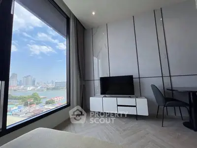 Modern living room with city view and sleek furniture