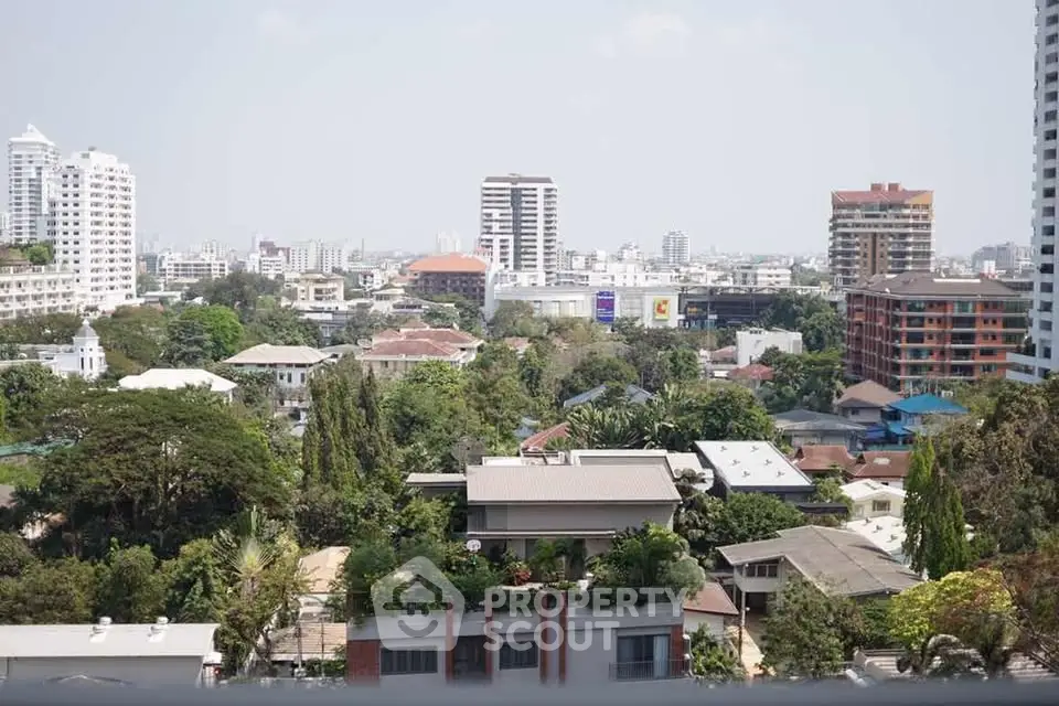 Stunning cityscape view showcasing urban skyline and lush greenery, perfect for real estate investment.