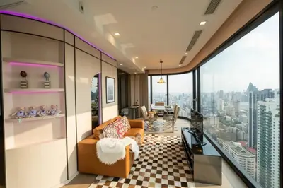 Luxurious high-rise living room with panoramic city views and modern decor