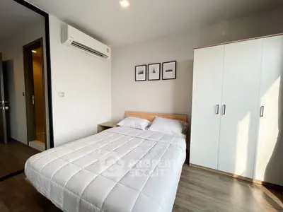 Modern bedroom with minimalist decor and ample natural light