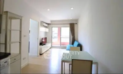 Bright modern living room with balcony access and sleek furniture.