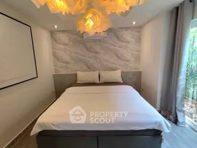 Modern bedroom with stylish lighting and elegant decor