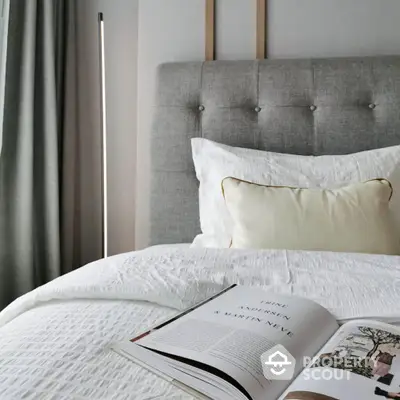 Cozy modern bedroom with stylish decor and comfortable bedding