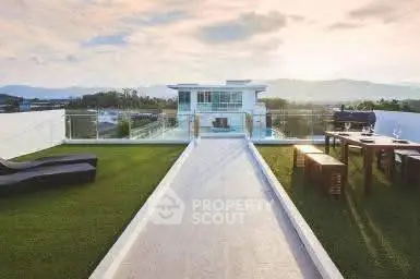Luxurious rooftop with stunning views and modern outdoor seating area.