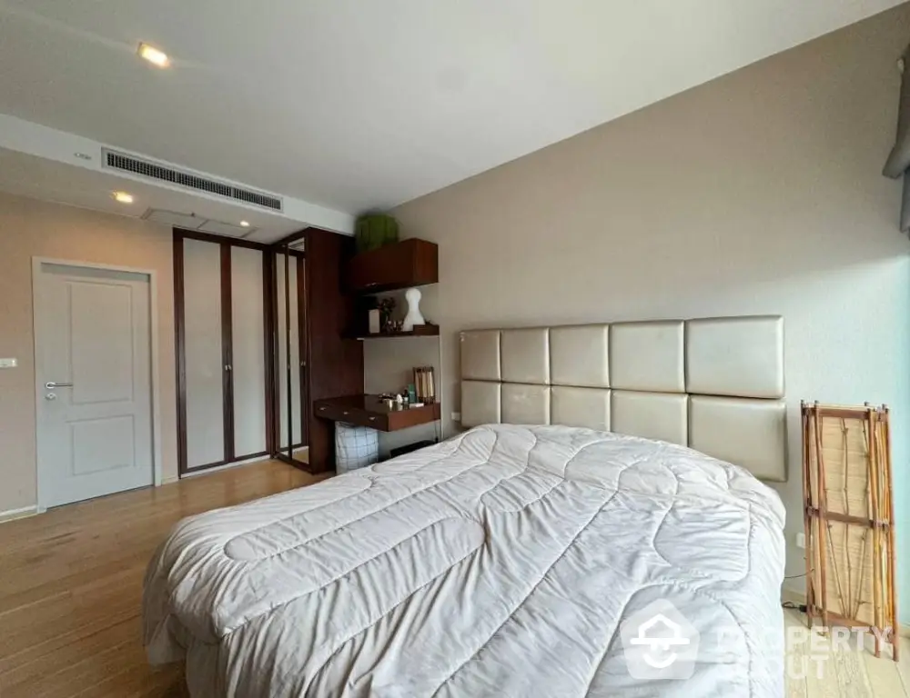 Spacious bedroom with modern design and ample natural light