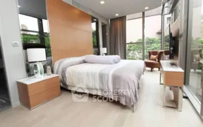 Luxurious modern bedroom with large windows and elegant decor