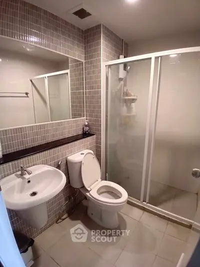 Modern bathroom with shower and sleek tile design