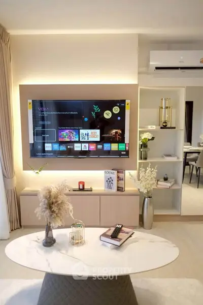 Modern living room with stylish decor and wall-mounted TV