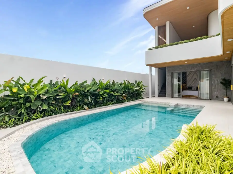 Luxurious modern villa with private pool and lush garden, perfect for relaxation and entertainment.
