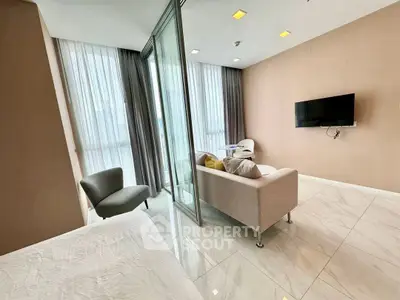 Modern living room with sleek design and floor-to-ceiling windows in a luxury apartment.