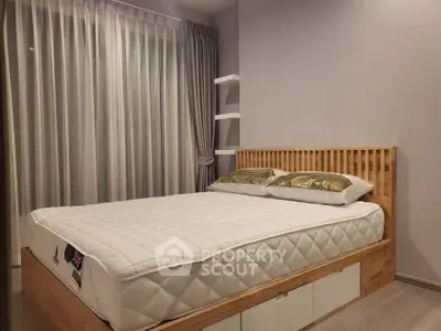 Modern bedroom with stylish wooden bed frame and elegant curtains