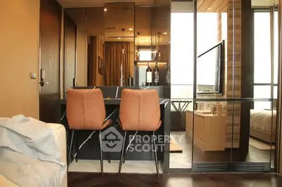 Modern apartment interior with stylish dining area and glass partition